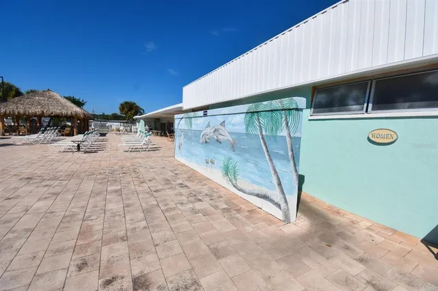 a view of a swimming pool with a lounge chairs