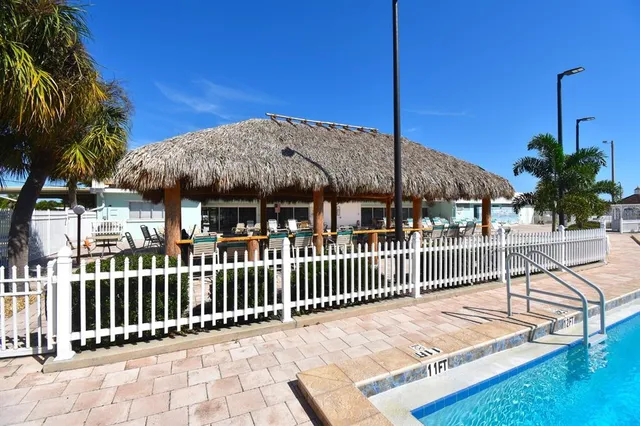 a outdoor space with lots of tables a garden view and chairs