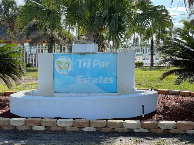 a view of a living room and kitchen with furniture