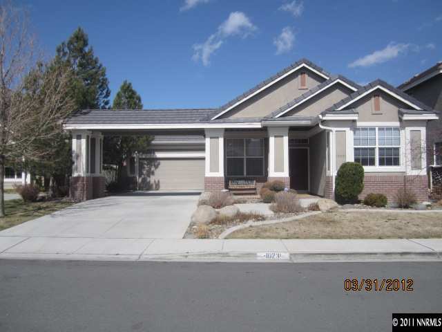 10231 Wolf Ridge Way Reno, NV 89521 - Photo 1 of 1 a front view of a house with a porch