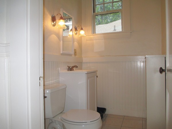 25 Colonial Road Worcester, MA 01602 - Photo 12 of 21 a white toilet sitting next to a bathroom sink