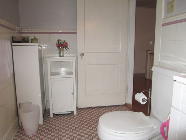 25 Colonial Road Worcester, MA 01602 - Photo 18 of 21 a white toilet sitting next to a bathroom sink and a shower