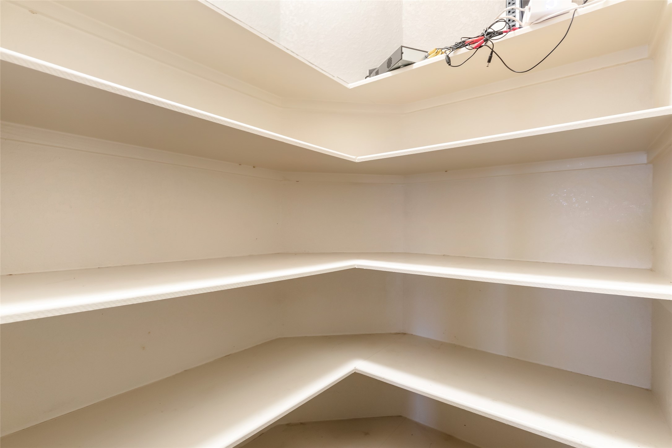 24706 East Burnaby Circle Spring, TX 77373 - Photo 18 of 34 Spacious walk-in pantry with ample shelving for organized storage.