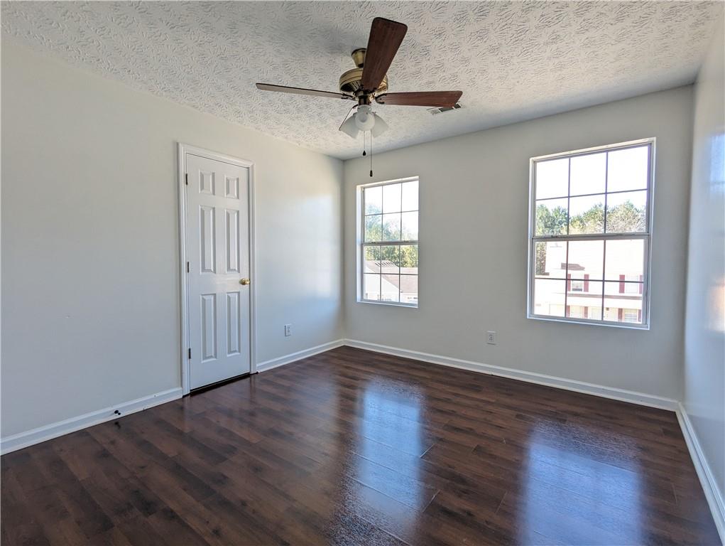 57 Inverness Trace Riverdale, GA 30274 - Photo 24 of 30 a view of empty room with wooden floor and fan