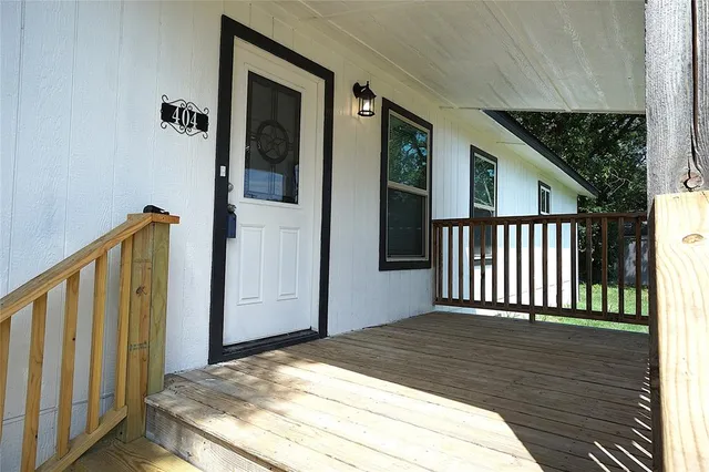 a view of balcony with wooden floor
