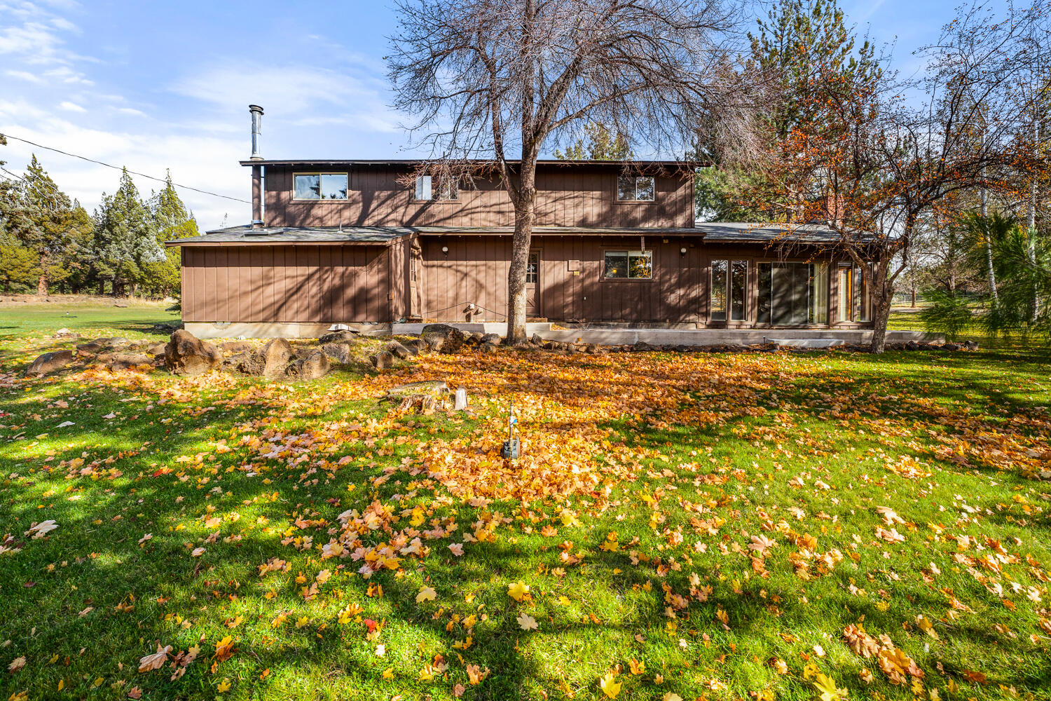 62255 Wallace Road Bend, OR 97701 - Photo 41 of 51 a view of a house with a yard