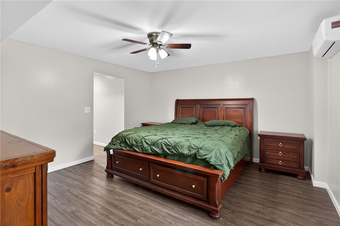 136 Loran Pointe Circle Seneca, SC 29672 - Photo 35 of 50 Well-appointed bedroom featuring a classic wooden bed frame and resilient flooring.