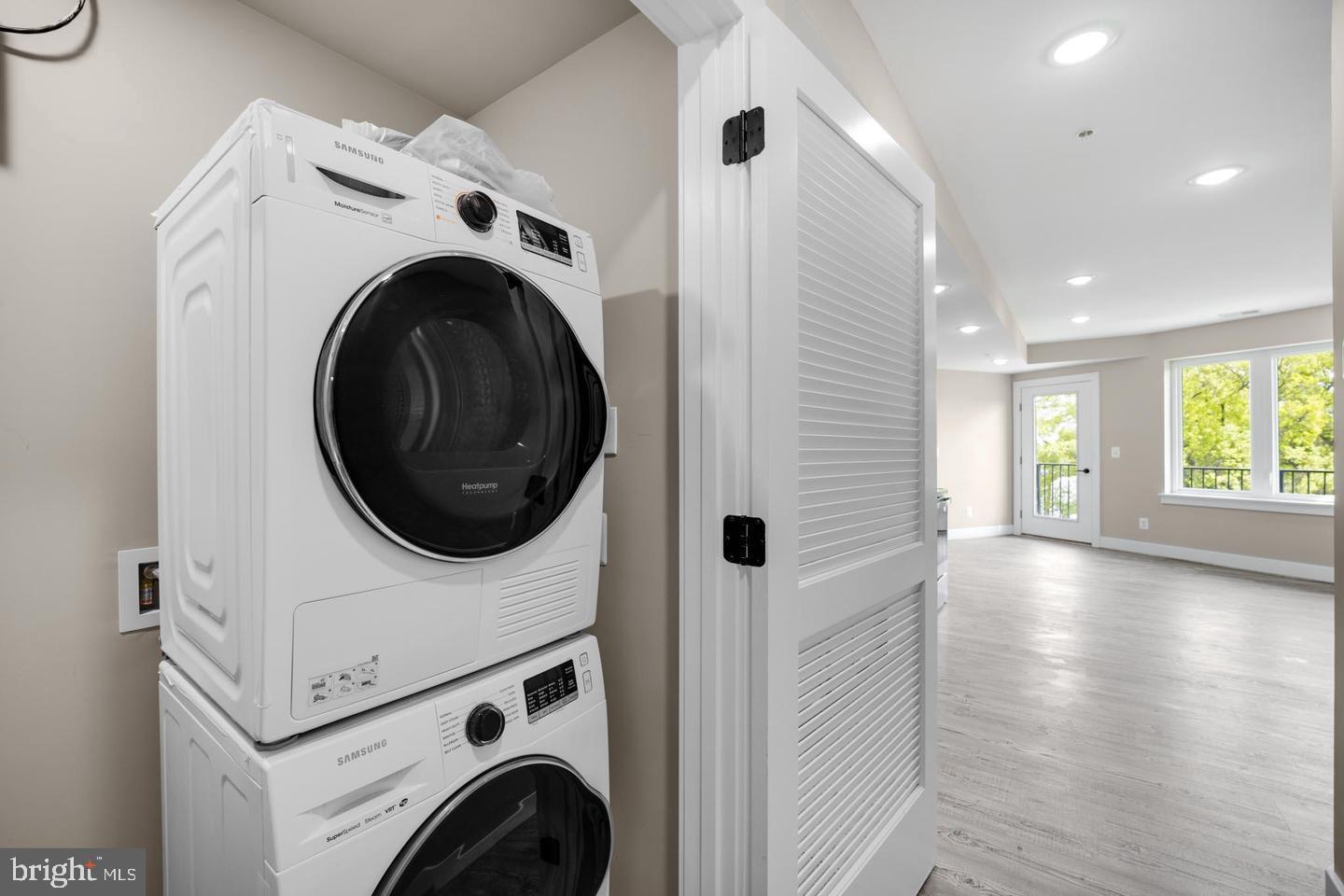 1617 Rhode Island Avenue Northeast, Unit 102 Washington, DC 20018 - Photo 5 of 17 a view of a hallway with washer and dryer