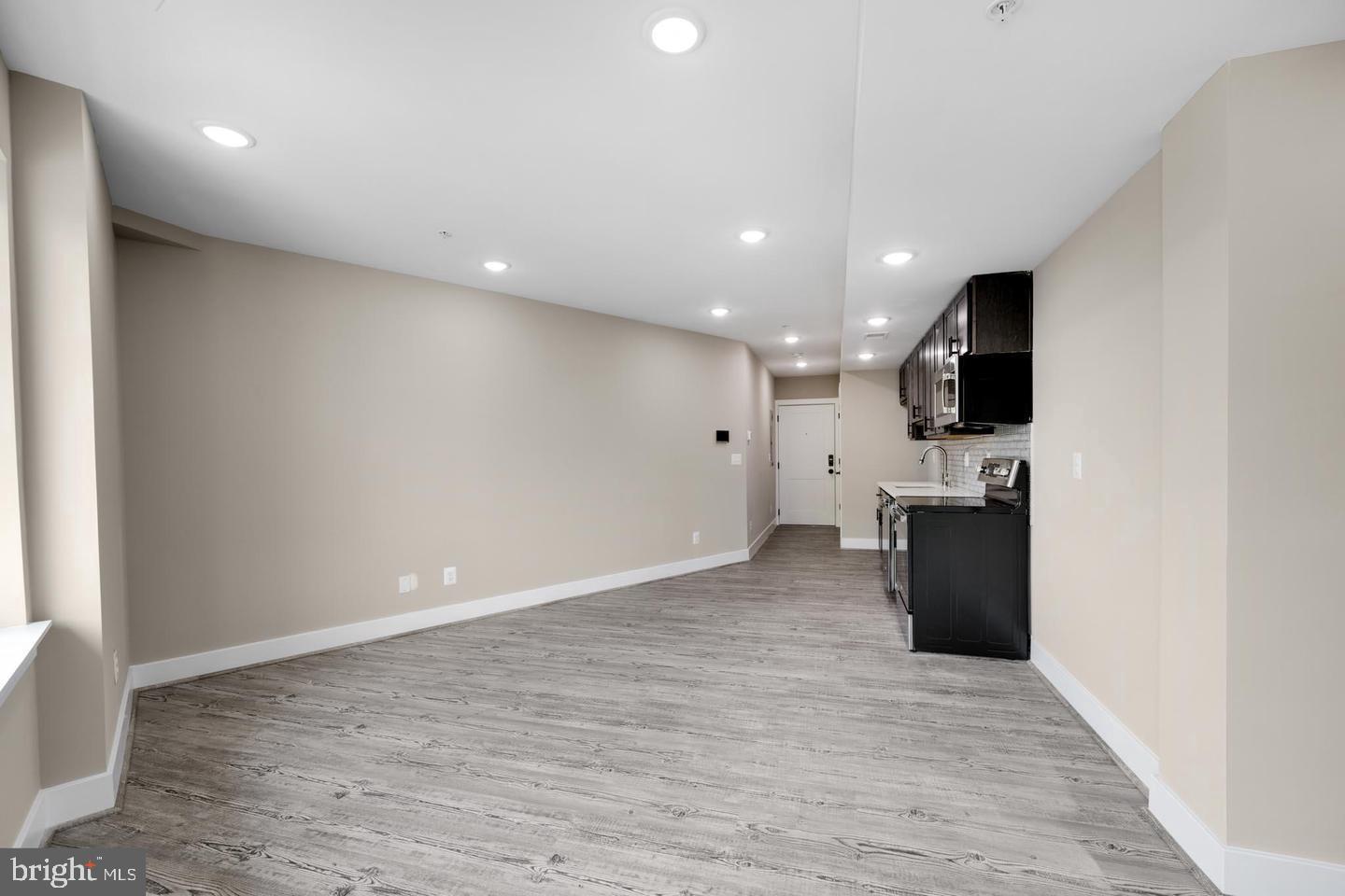 1617 Rhode Island Avenue Northeast, Unit 102 Washington, DC 20018 - Photo 6 of 17 a view of a kitchen with refrigerator and a sink