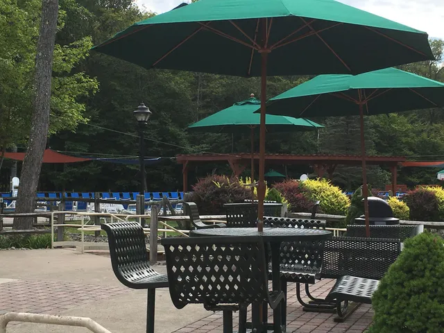 a view of swimming pool with sitting area