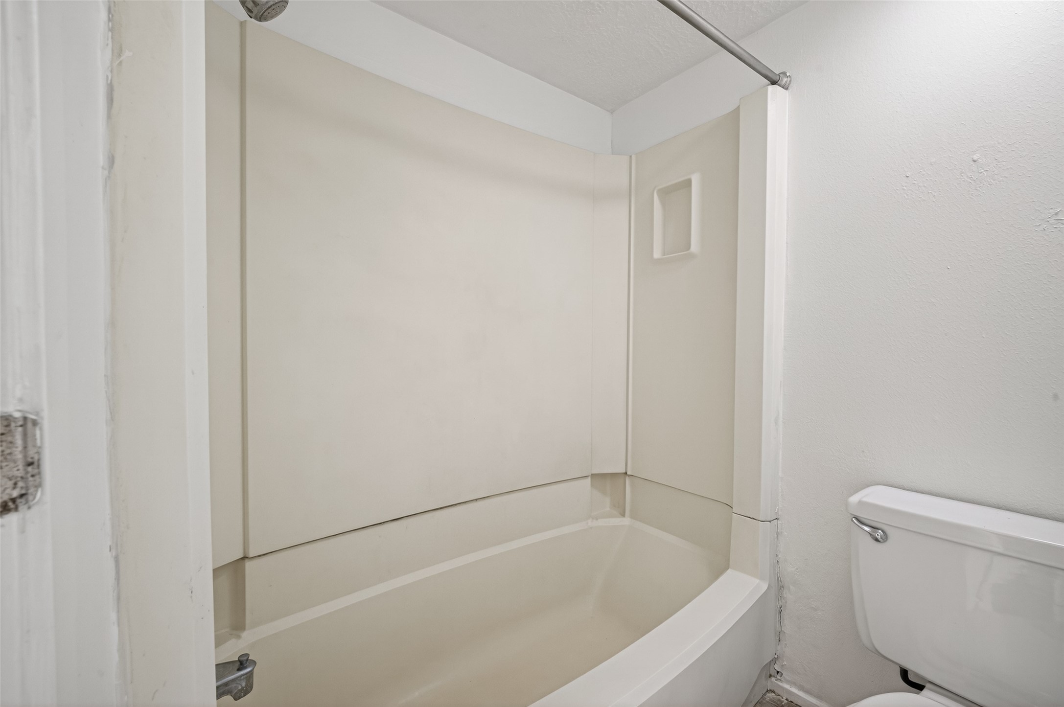 1106 East Red Cedar Circle Spring, TX 77380 - Photo 30 of 43 a white bath tub sitting next to a toilet