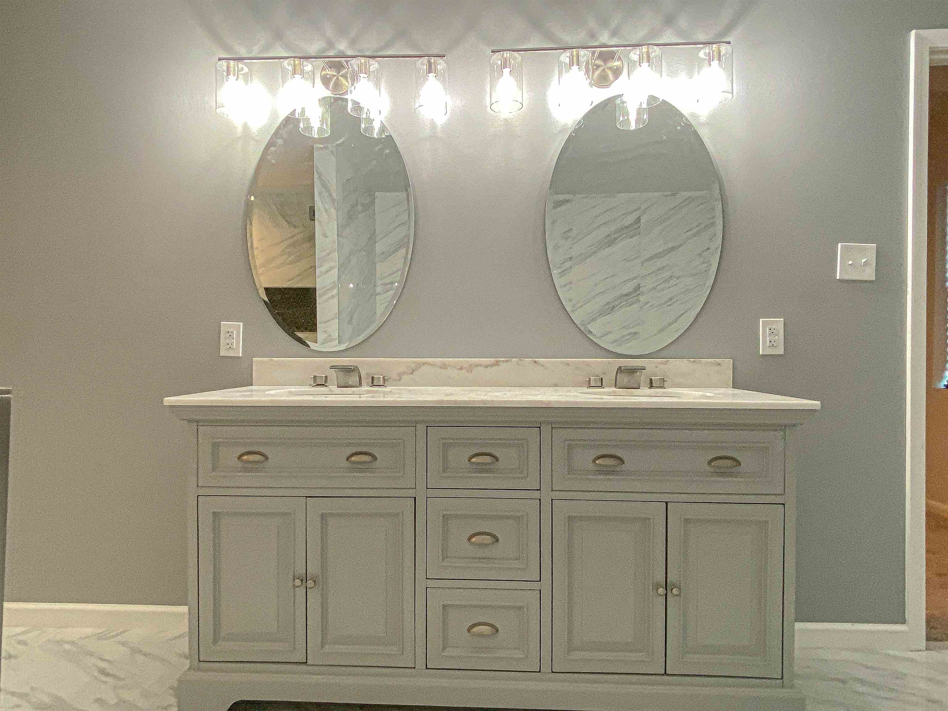 157 Pickett Road Memphis, TN 38109 - Photo 15 of 24 a bathroom with a sink and mirror