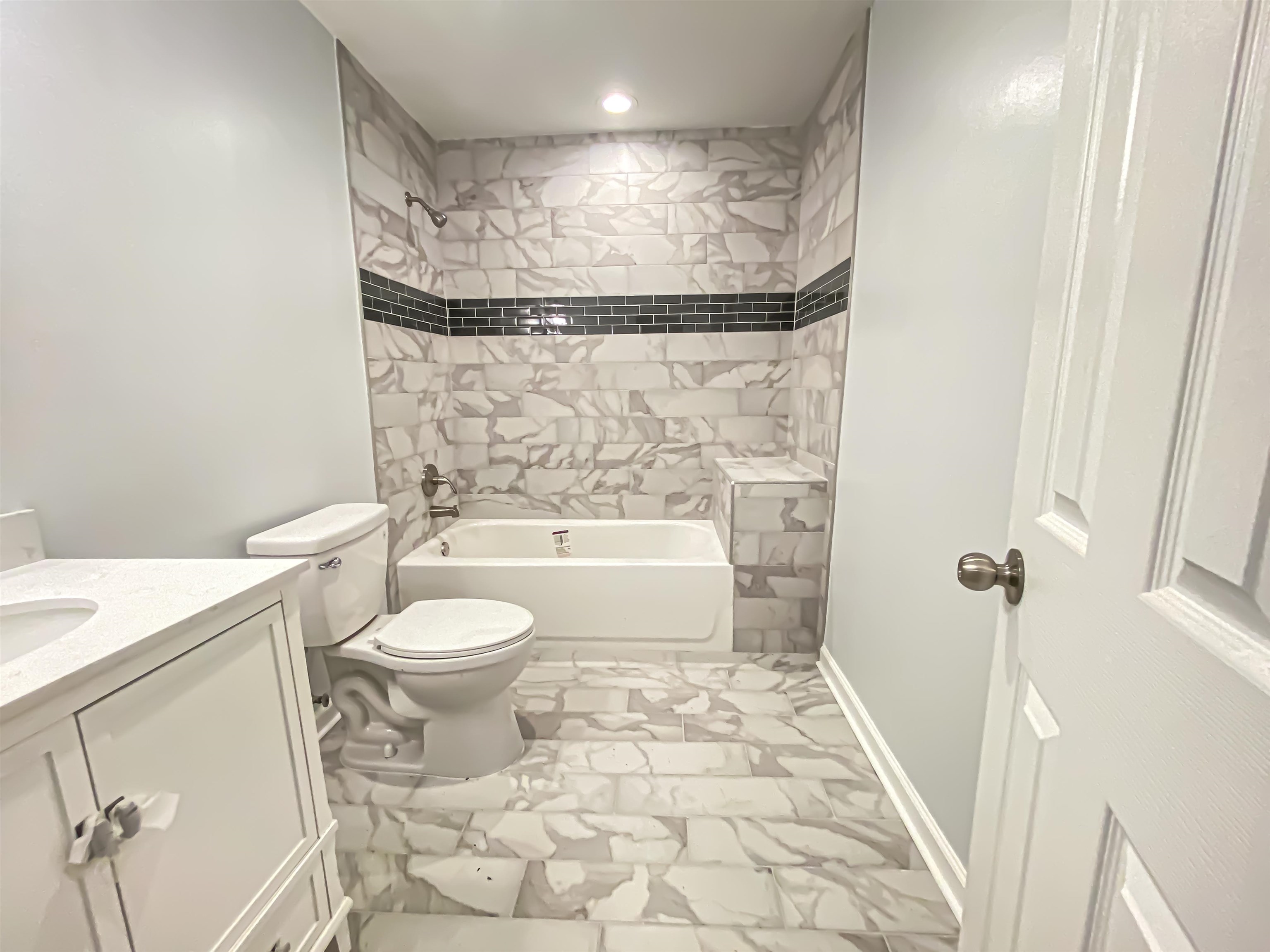 157 Pickett Road Memphis, TN 38109 - Photo 22 of 24 a bathroom with a toilet a sink and a shower