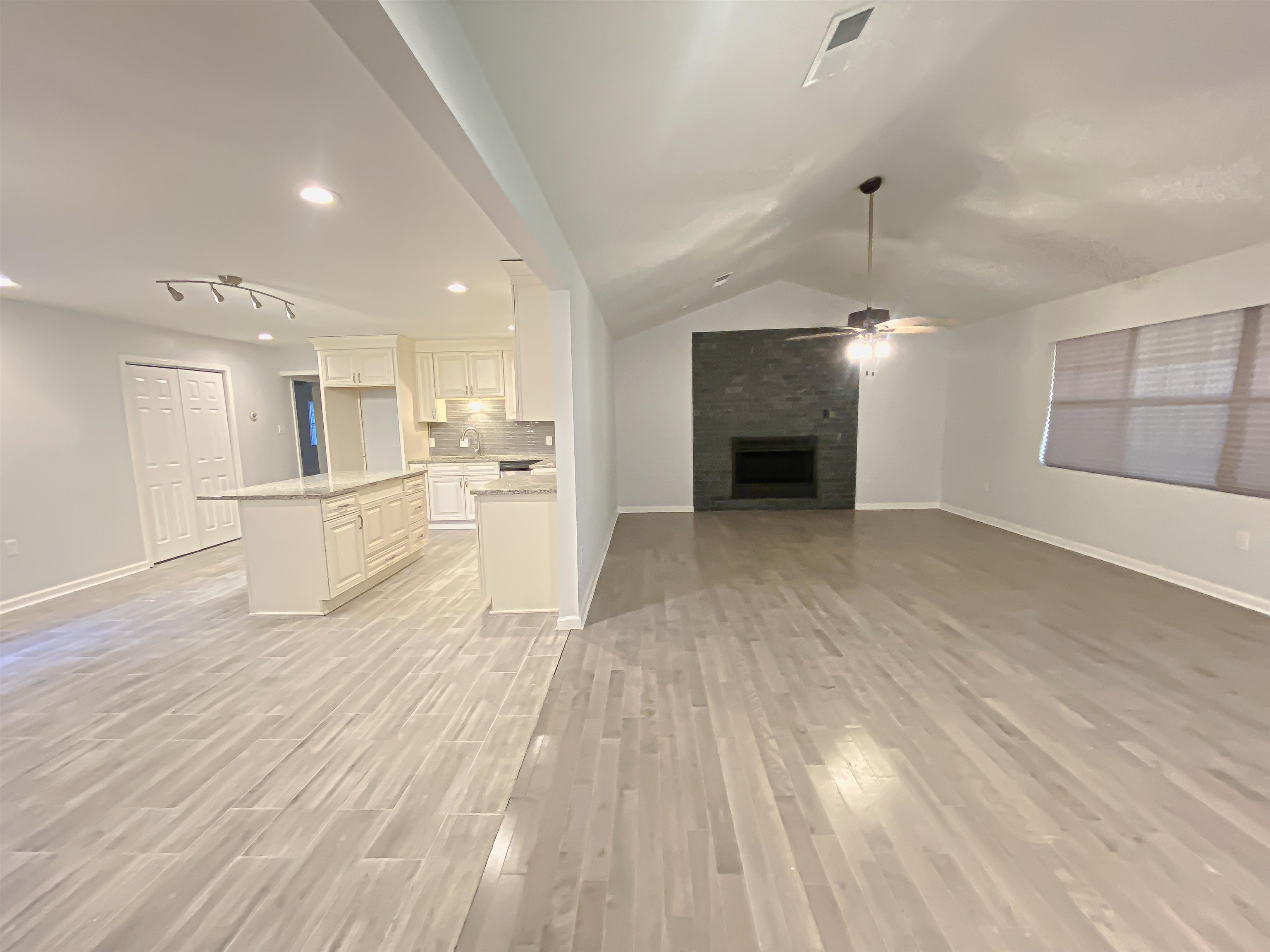 157 Pickett Road Memphis, TN 38109 - Photo 3 of 24 a view of a kitchen with furniture and a fireplace