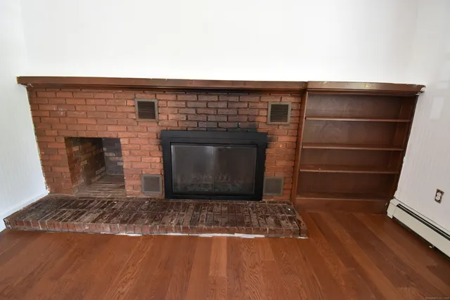 a living room with a fireplace
