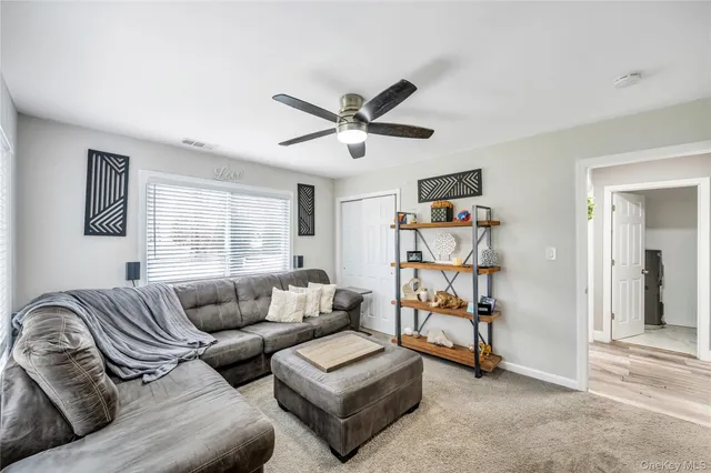 a living room with furniture and a window