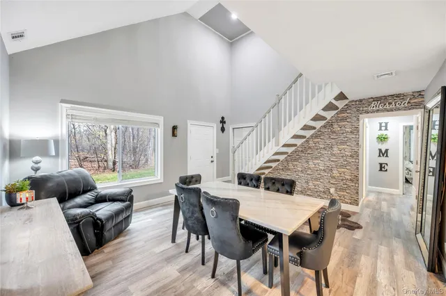 a view of a livingroom with furniture and wooden floor