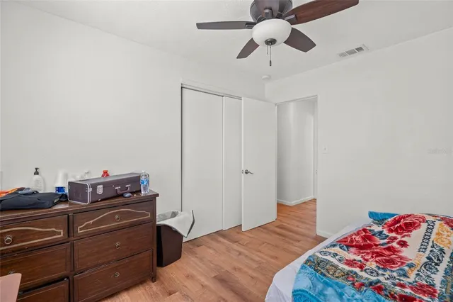 a bedroom with a bed and cabinets
