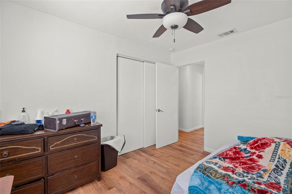 2343 Prospect Street Sarasota, FL 34239 - Photo 12 of 33 a bedroom with a bed and cabinets