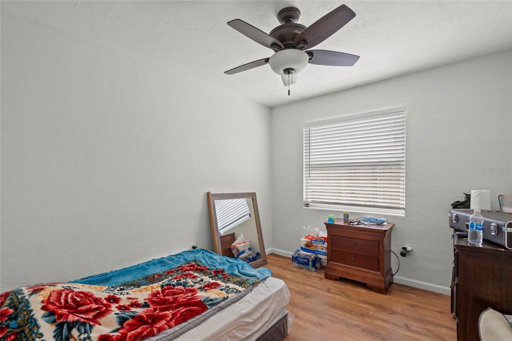 2343 Prospect Street Sarasota, FL 34239 - Photo 13 of 33 a bedroom with a bed and wooden floor