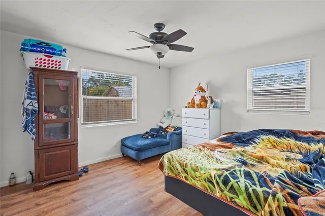 a bedroom with bed and window