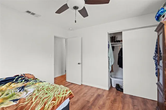 a bedroom with a bed and a walk in closet