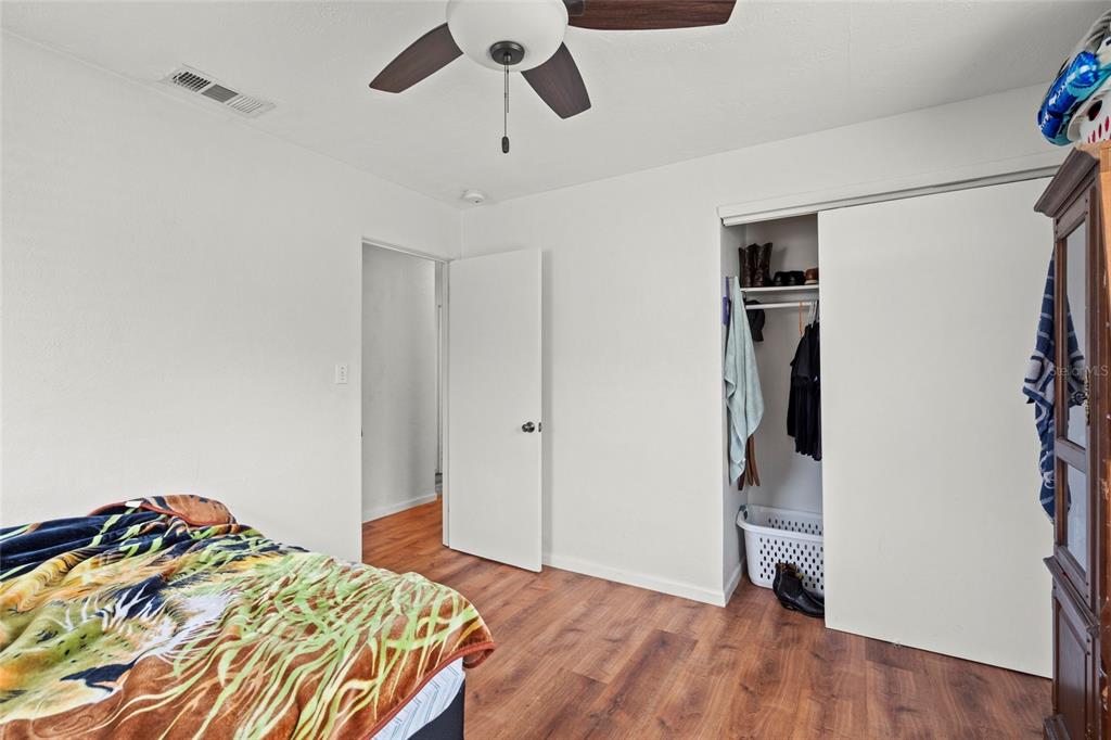 2343 Prospect Street Sarasota, FL 34239 - Photo 16 of 33 a bedroom with a bed and a walk in closet