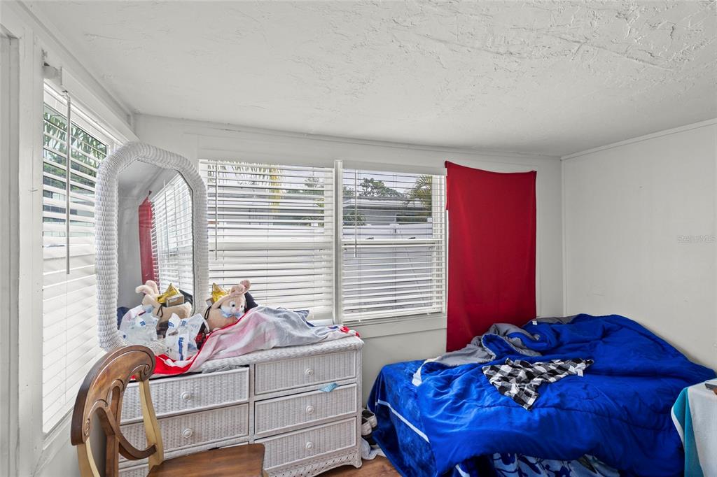 2343 Prospect Street Sarasota, FL 34239 - Photo 9 of 33 a bedroom with furniture and a window