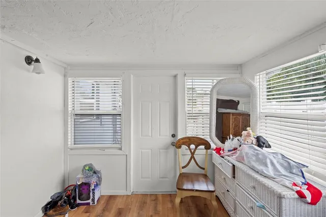 a bedroom with furniture and a window