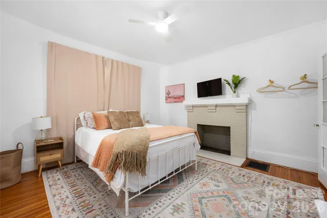 a bed room with a bed and a fireplace