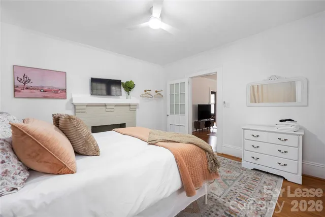 a bed room with a bed and a television