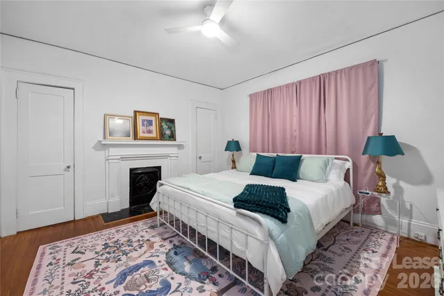 a bed room with a bed and a fireplace