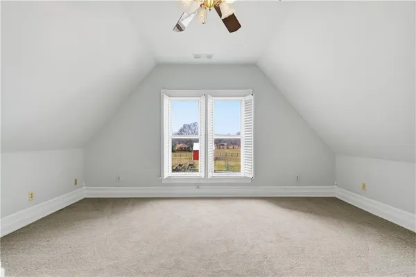 an empty room with a empty space and a window