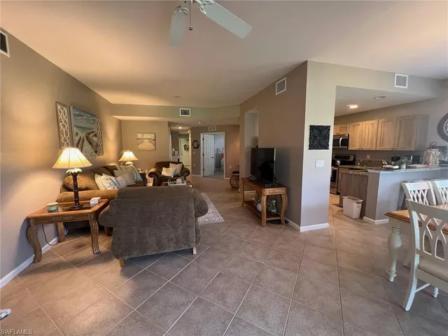a bedroom with a bed wooden floor and window