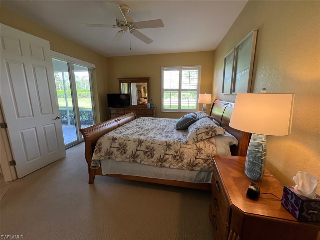 6864 Ascot Drive, Unit 101 Naples, FL 34113 - Photo 16 of 40 a bedroom with a bed and window