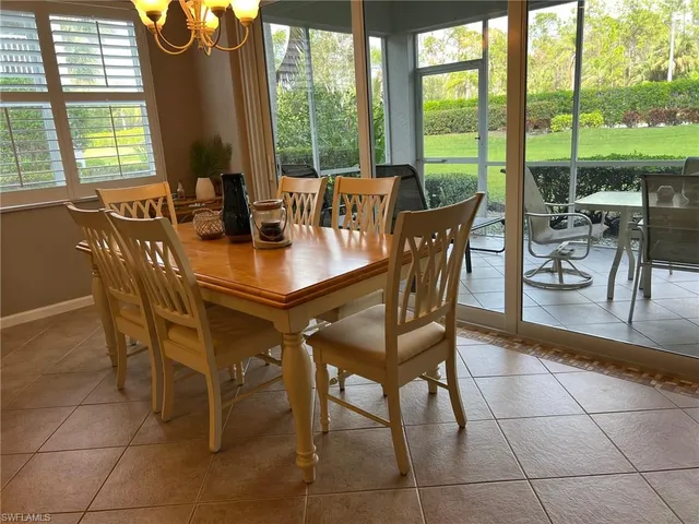 a kitchen with stainless steel appliances granite countertop a sink refrigerator stove and microwave