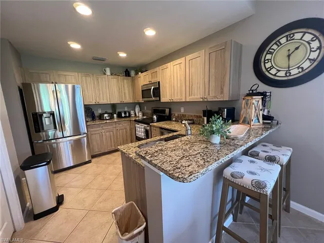 a kitchen with a table and chairs in it