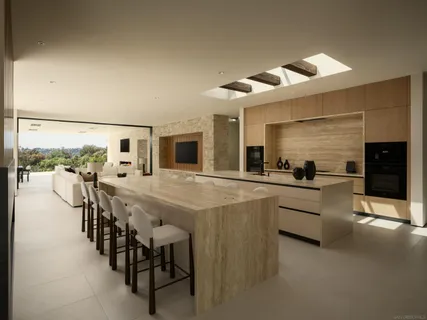 a large kitchen with lots of counter space and stainless steel appliances