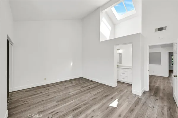 a view of a room that has wooden floor in front of it
