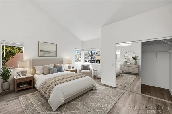 a bedroom with a bed and a couch