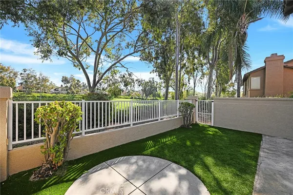 a view of a deck with a large trees