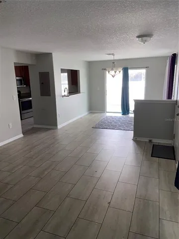 a view of livingroom with hardwood floor and a window