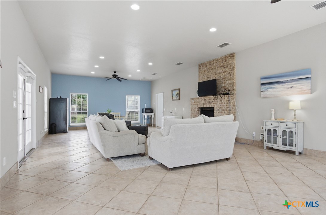 642 Phantom Rider Trail Spring Branch, TX 78070 - Photo 29 of 41 a living room with furniture and a flat screen tv