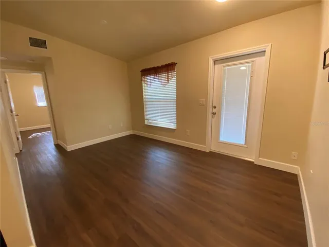 a kitchen with stainless steel appliances granite countertop a refrigerator a stove top oven a sink and dishwasher