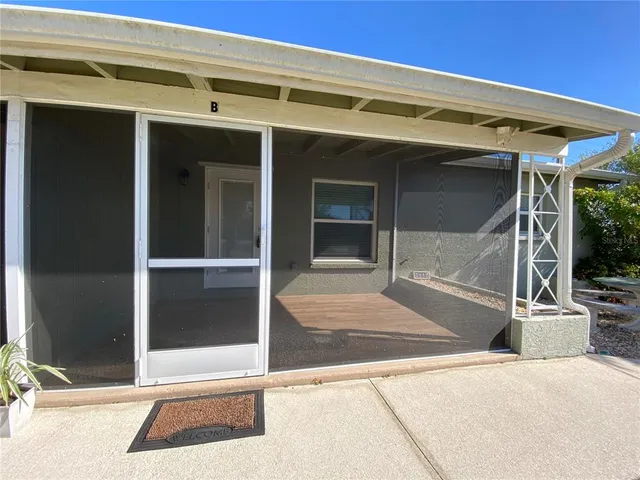 a backyard of a house with seating space