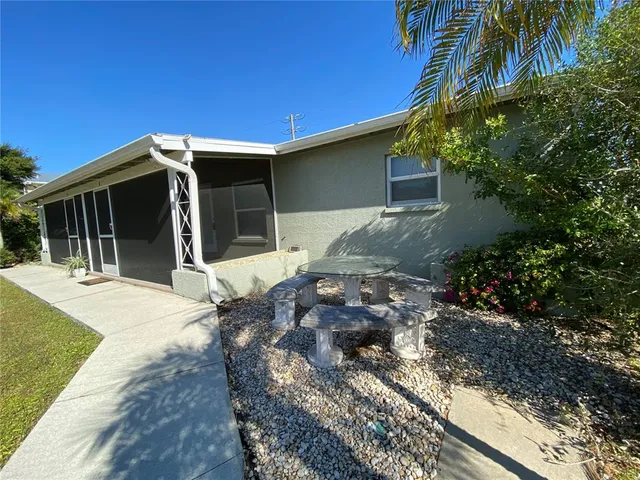 a backyard of a house with yard and garage
