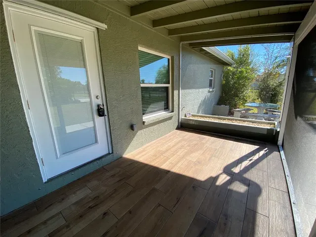 a view of a room with a large window