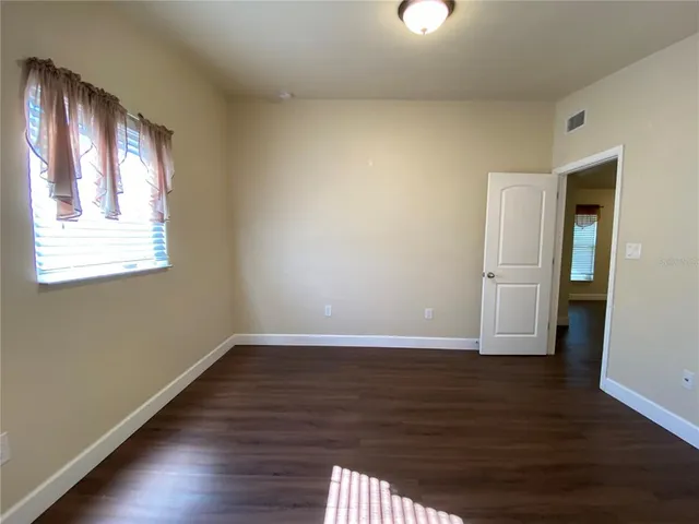a bathroom with a sink shower and a mirror