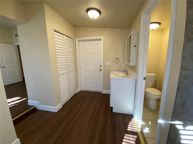 a bathroom with a sink a mirror and shower