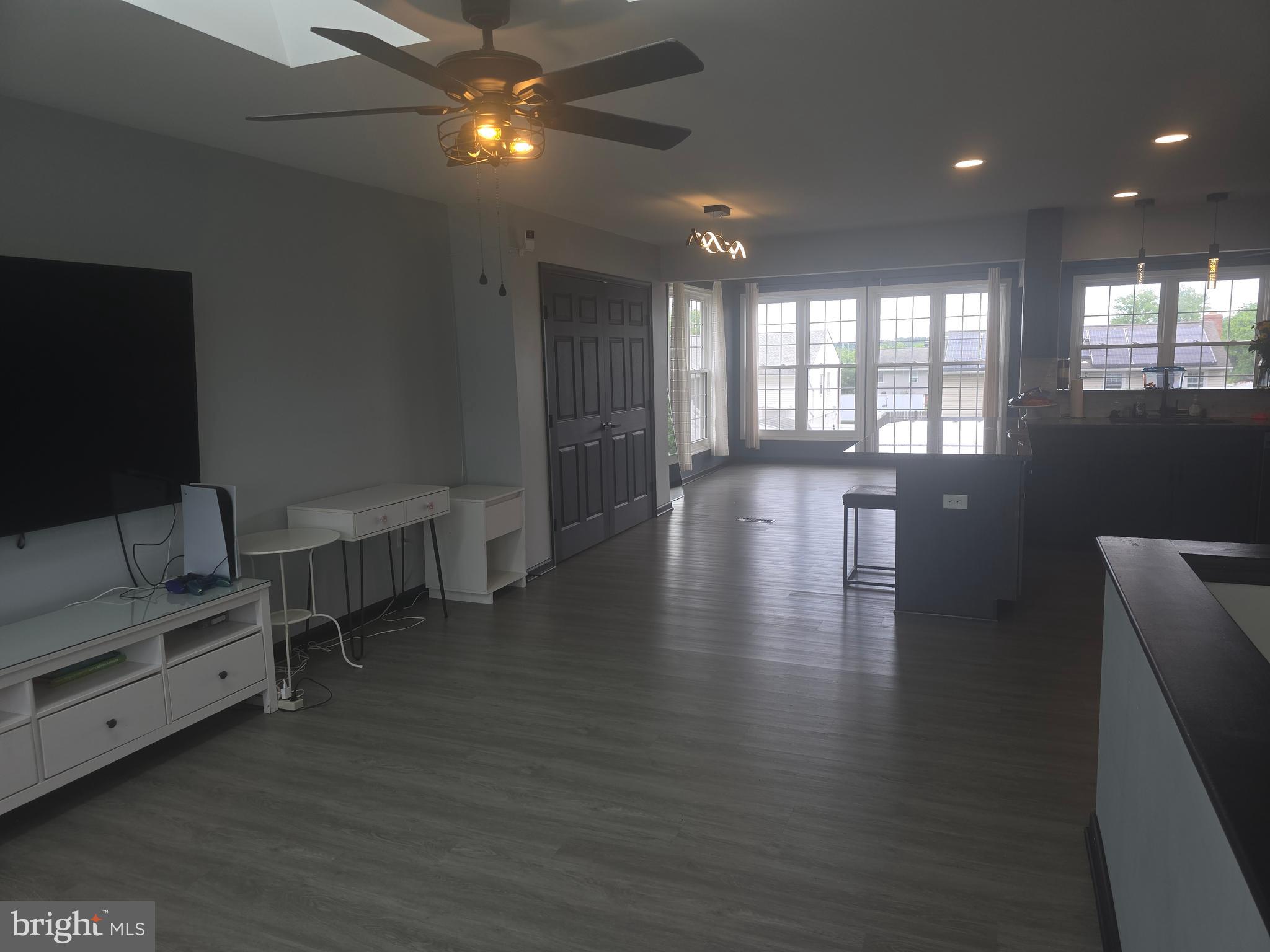 7513 Saffron Court Hanover, MD 21076 - Photo 7 of 42 a view of a livingroom with furniture wooden floor and windows